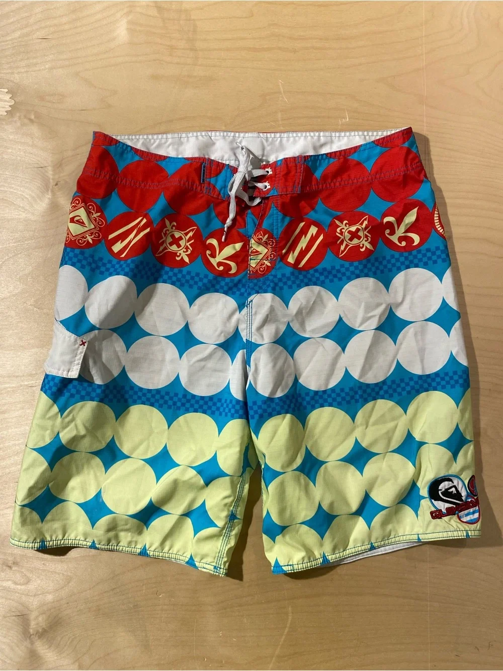 QuikSilver Red, Blue & Yellow Patterned Board Shorts 38 (BM)
